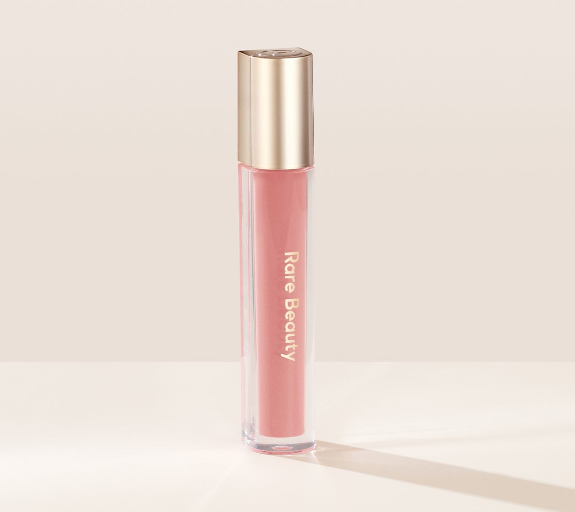 Rare Beauty Stay Vulnerable Glossy Lip Balm in Nearly Petal Rare Beauty Stay Vulnerable Glossy Lip Balm in Nearly Petal