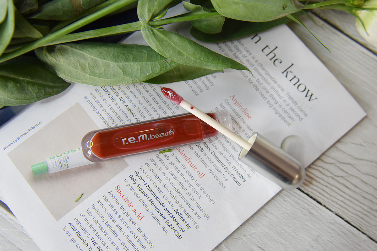 R.E.M. Beauty Essential Drip Glossy Balm in Cherry Cola